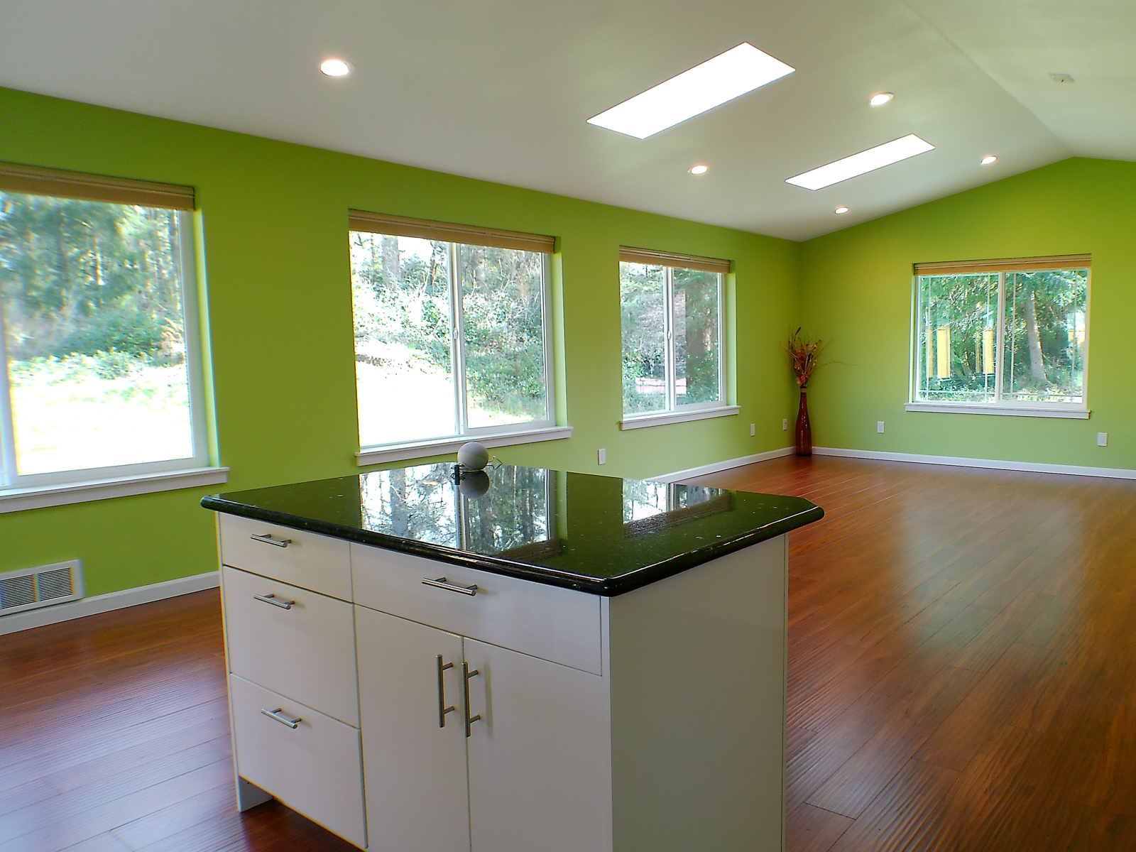 The kitchen and living room flow together in a seamless open-plan space.