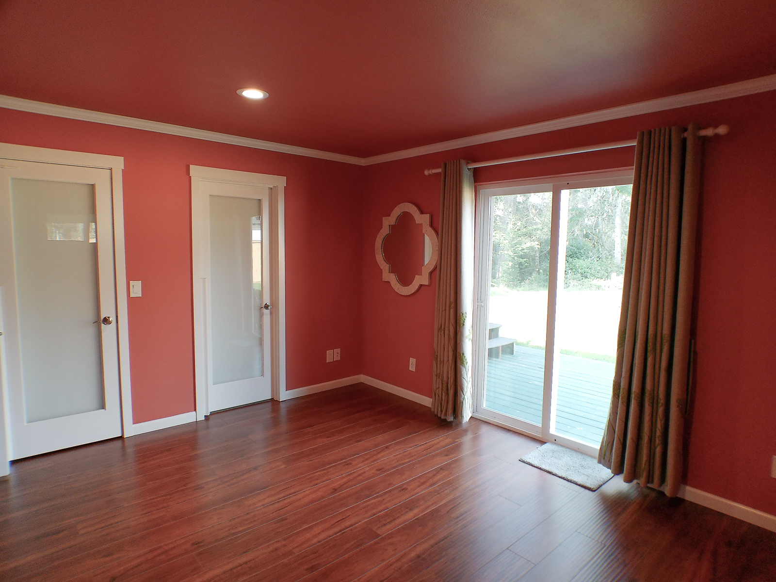 The master bedroom features a walk-in closet and en-suite bathroom. Elegant colors and crown molding lend the space a refined, modern character.