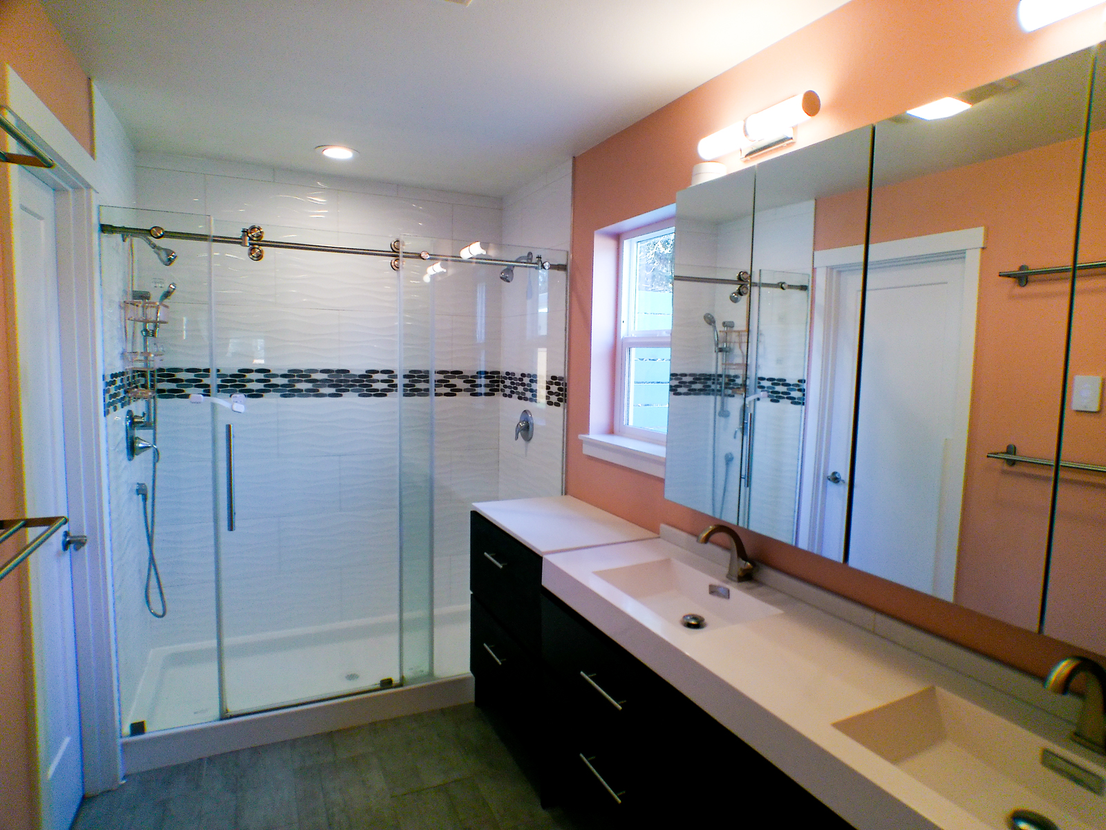 The master bathroom features a tiled double shower with sliding glass doors. Heated floors with a smart programmable thermostat ensure a warm welcome underfoot whenever you need it. A separate water closet provides added privacy.