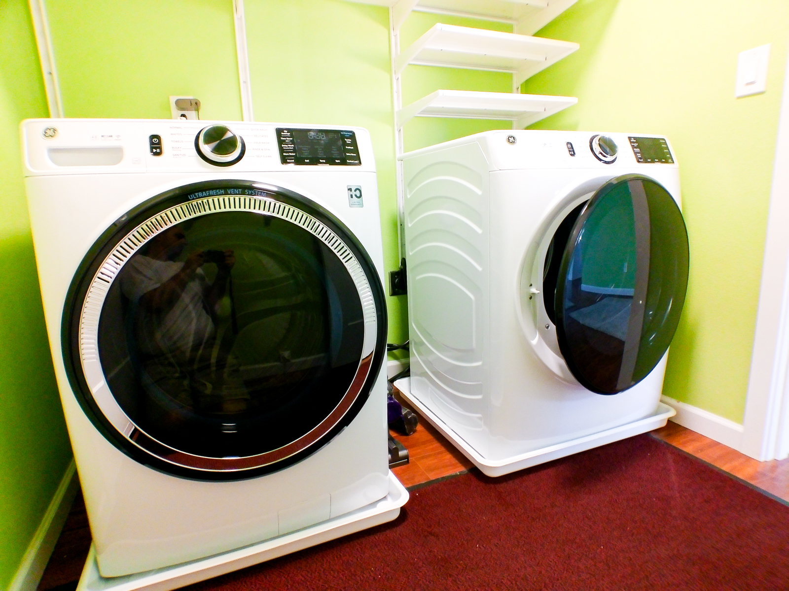 The laundry room features a brand-new high-capacity washer and dryer with convenient built-in shelving.
