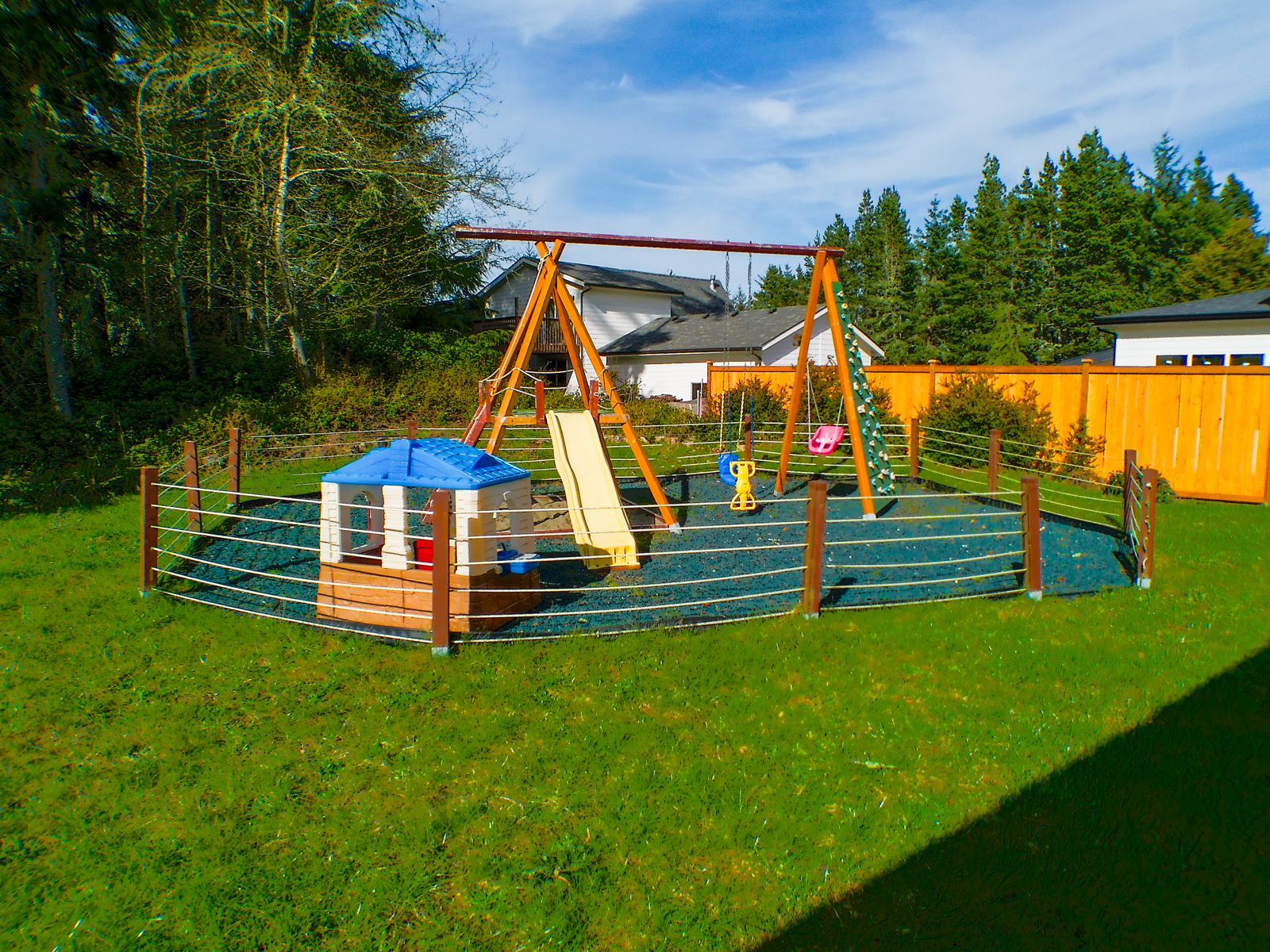 The backyard playground is a fantastic foundation that can grow with your kids — extend the climbing wall, add rope swings, or upgrade to longer slides as they get bigger.